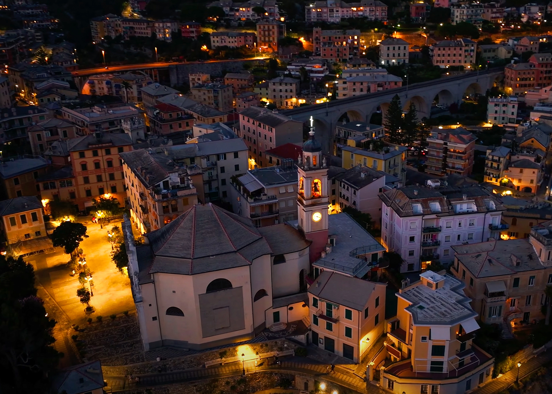 Aerial night view of Bogliasco with illuminated church and town streets