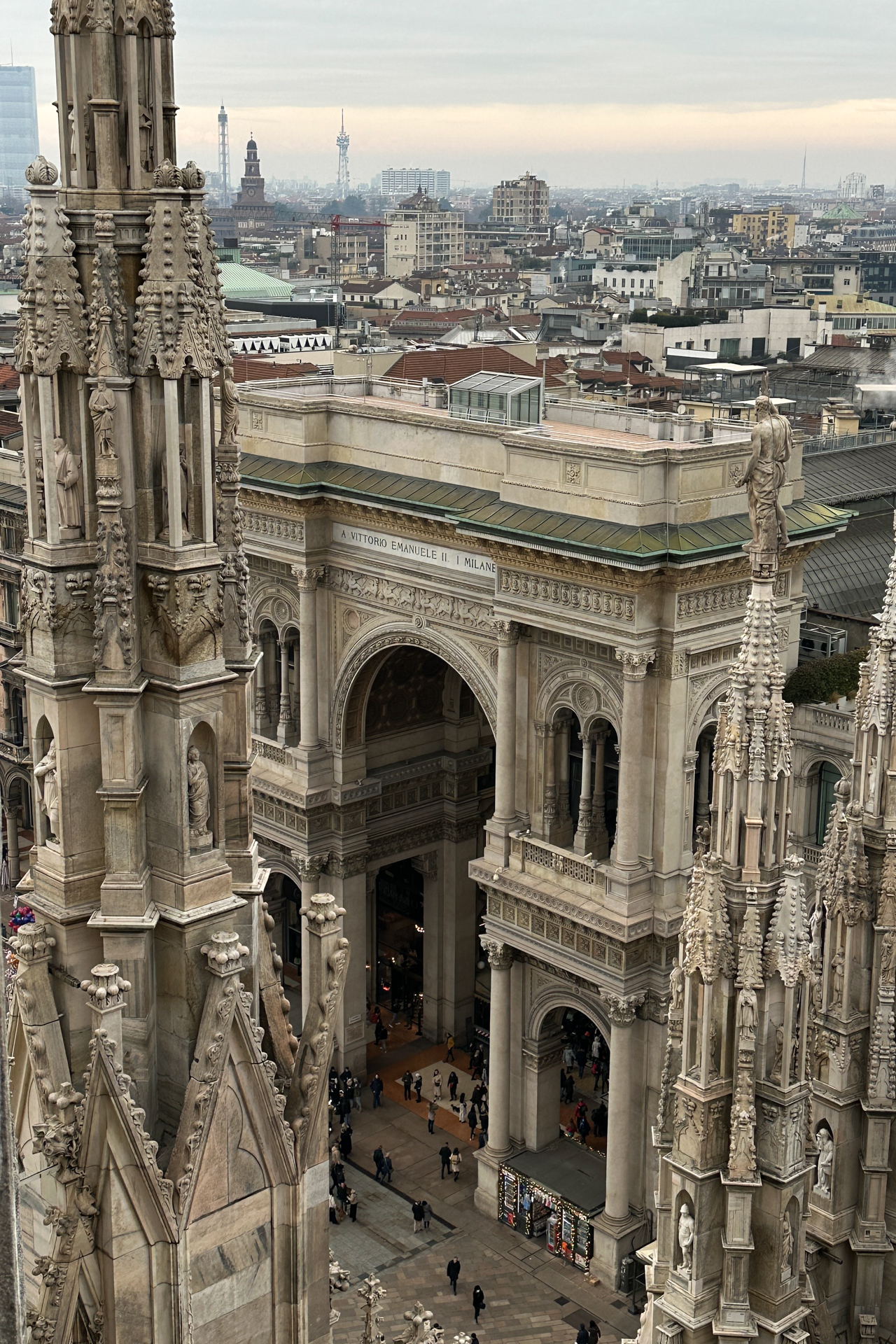 Aerial view of Galleria Vittorio Emanuele II entrance from Milan Duomo rooftop