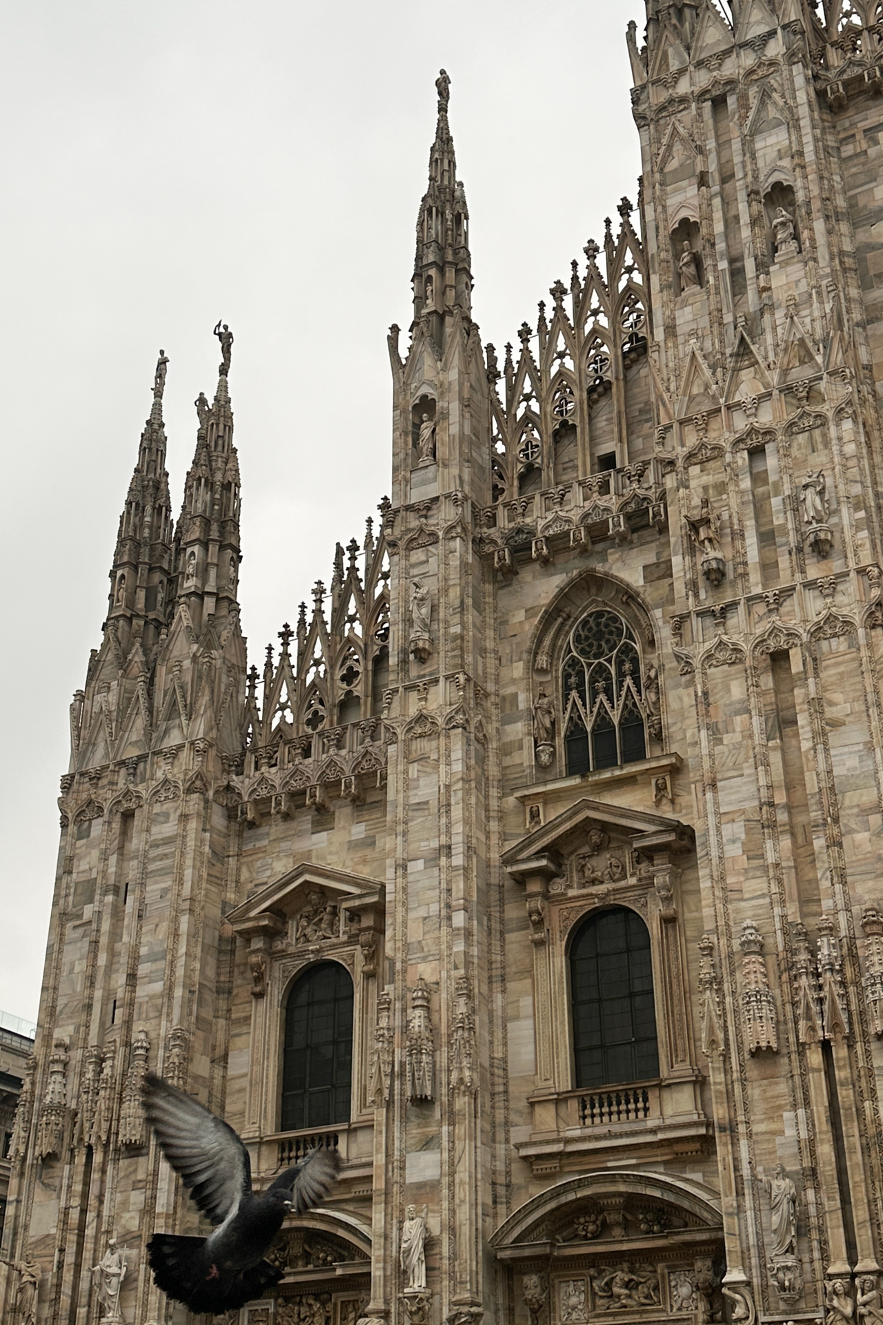 Facade of Milan Cathedral Duomo with gothic architecture, Italy.