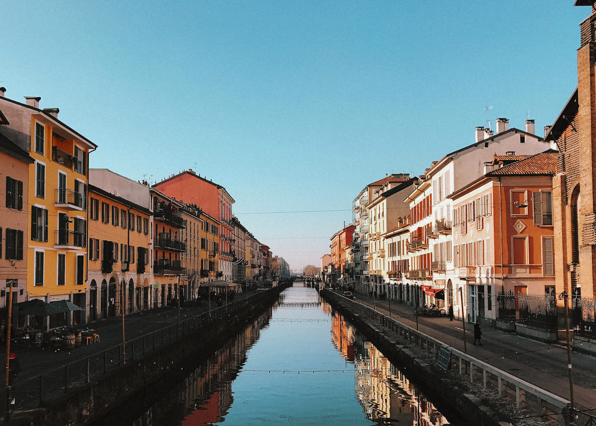 Colorful houses reflecting on the Navigli canal in Milan, Italy