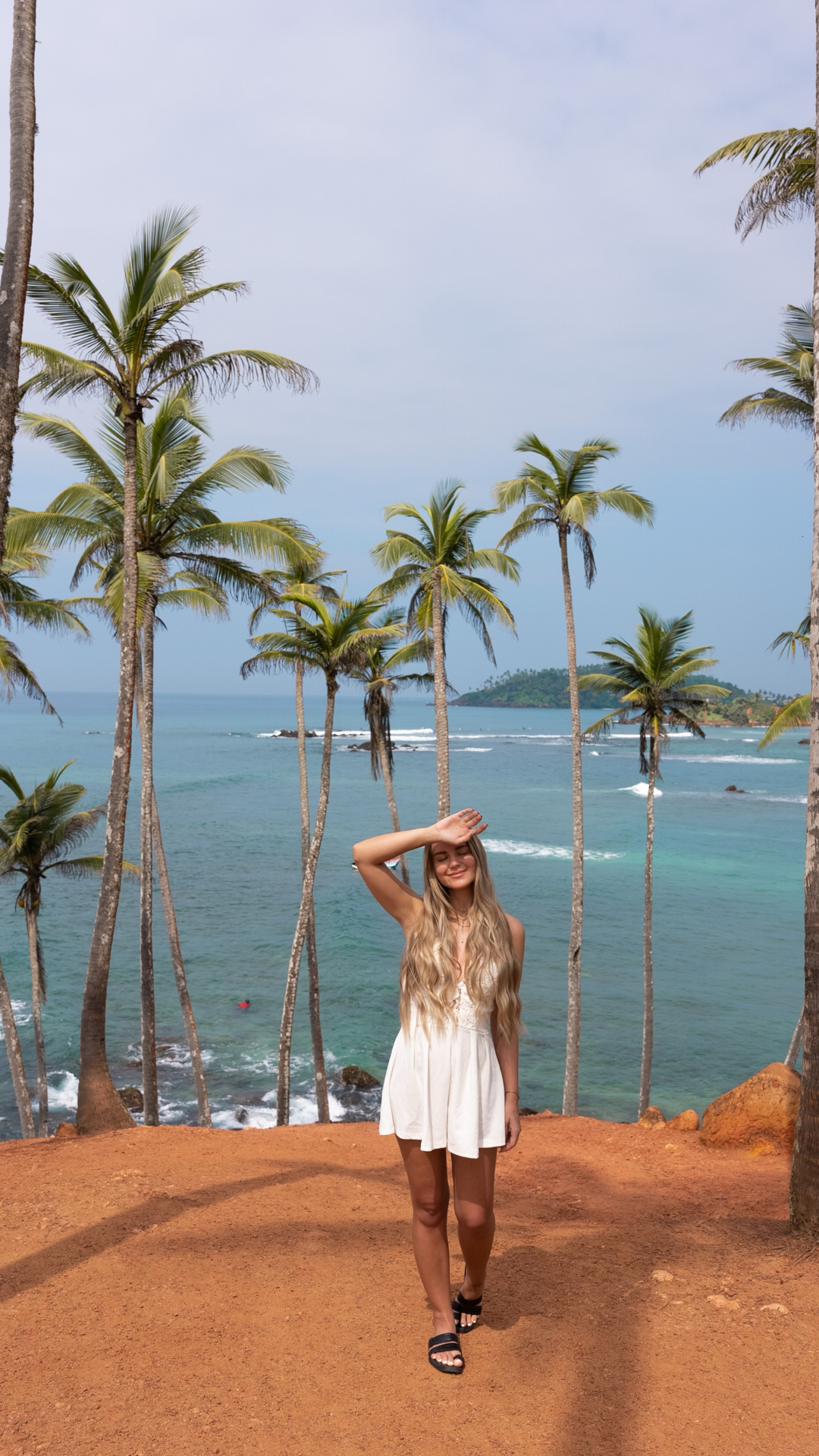 Mirissa Woman standing at Coconut Tree Hill viewpoint in Mirissa, Sri Lanka