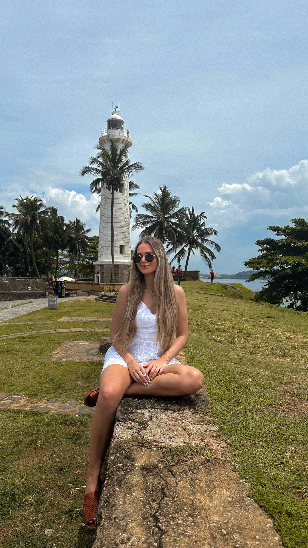 Galle Fort Woman sitting near Galle Lighthouse at Galle Fort, Sri Lanka