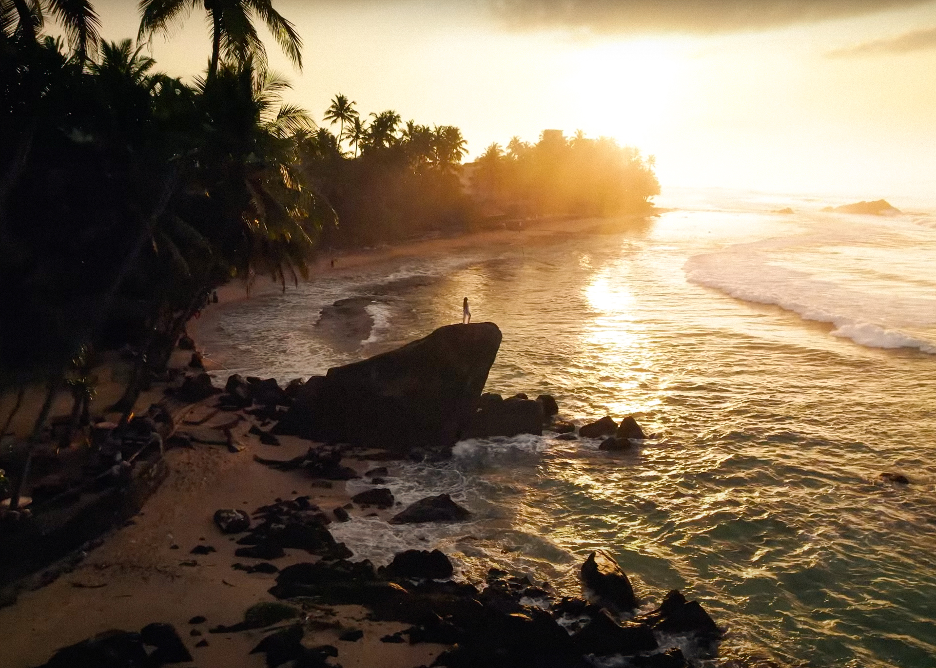 Aerial image over Wijaya Rock/Frog Rock at Dalawella Beach in Sri Lanka.