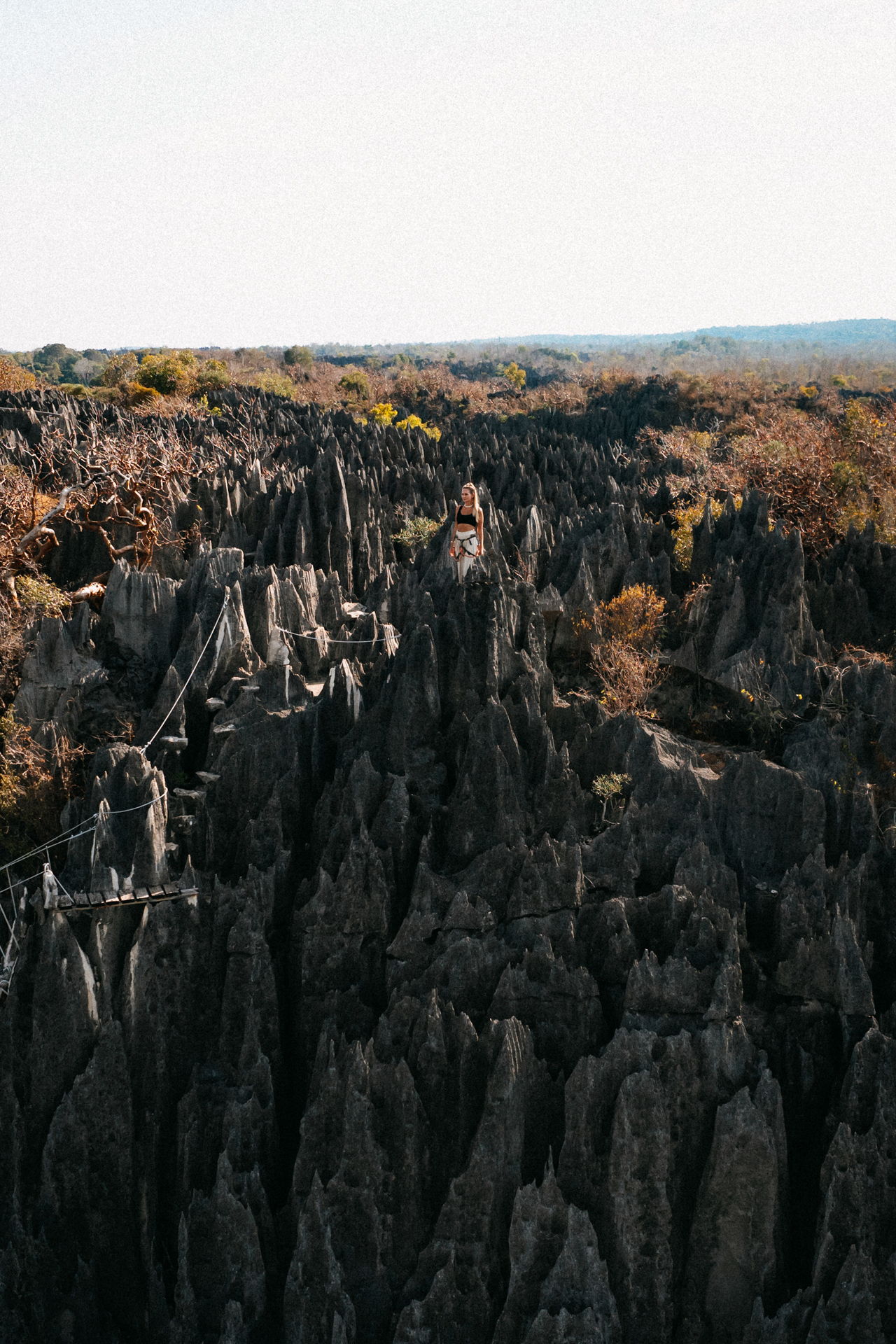 Bekopaka Traveler exploring the sharp limestone formations of Tsingy de Bemaraha.