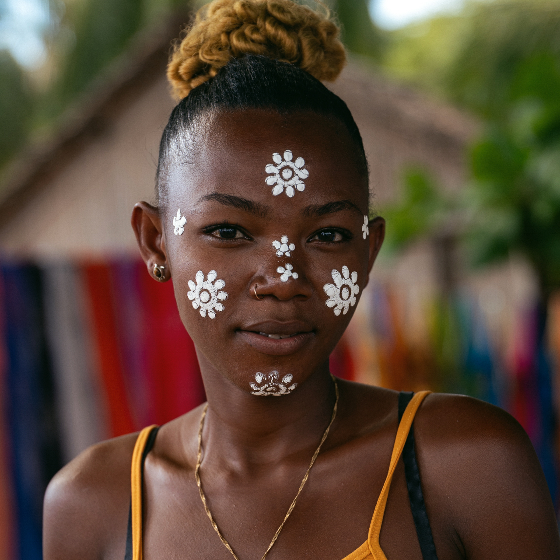 Traditions in Madagascar Portrait of a Malagasy woman with traditional white face painting designs.