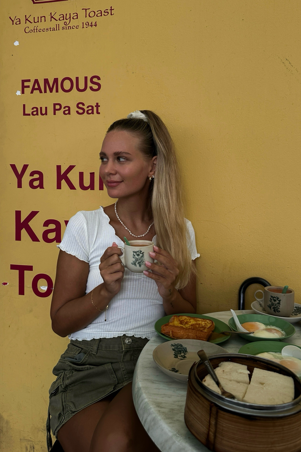 Food in Singapore Enjoying kaya toast breakfast with coffee at Ya Kun Kaya Toast in Singapore.